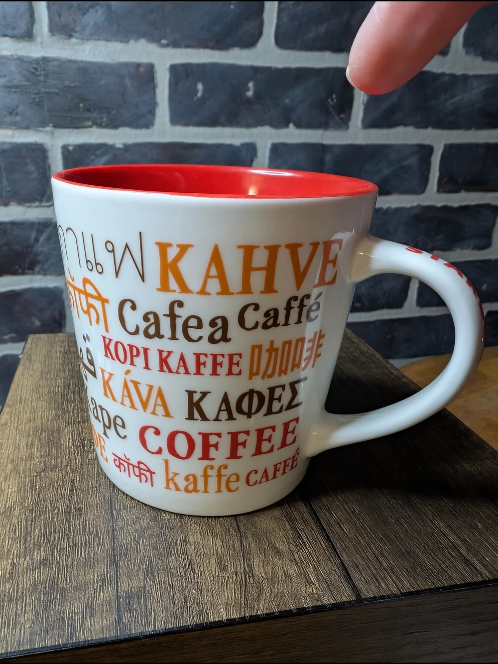 White and Red Coffee Mug with Multilingual 'Coffee' Design